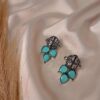 Nayra blue oxidised floral earrings with teardrop stone design and antique finish